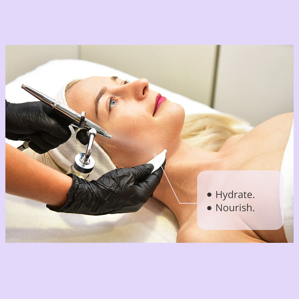 A woman receiving a facial treatment with oxygen sprayer.