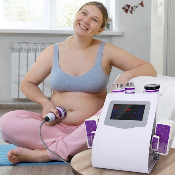 Woman using a home 40k cavitation machine on her abdomen in a bright room.