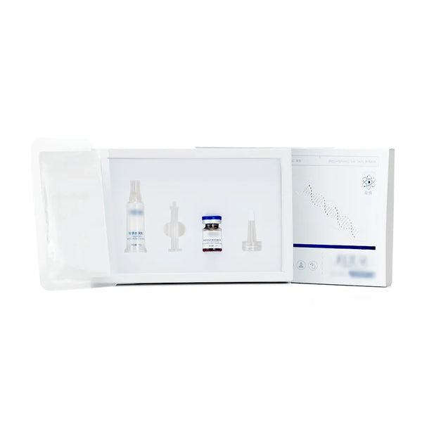 A white skincare or cosmetic kit shown open against a white background, containing several small vials and applicator tools, with a printed insert card on the right side.