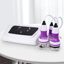 White and purple electronic device on a white surface with a white curtain background