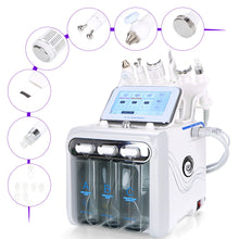 Beauty device with multiple attachments and a digital display on a white background