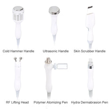 Set of different handles for a medical or cosmetic device on a white background