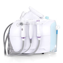 White dental cleaning device with various attachments on a white background