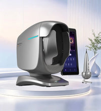 A modern silver and black AI Skin Analyzer on a white circular platform, shown alongside a smartphone displaying a patient profile and a small metallic accessory in a clean, futuristic room setting.