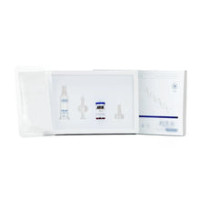 A white skincare or cosmetic kit shown open against a white background, containing several small vials and applicator tools, with a printed insert card on the right side.