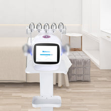 Beauty device with multiple nozzles on a stand in a room setting.