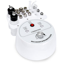 Microdermabrasion device with various attachments on a white background