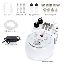 Microdermabrasion machine with various attachments on a white background