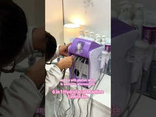 A beautician unboxes a hydro dermabrasion machine for facial skin care