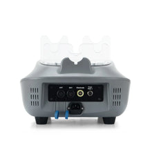 The rear view of a cet ret therapy beauty device, likely an IPL skin treatment unit, featuring a black control panel with input/output ports, power cord, and two blue grounding leads, with two clear protective covers on top.