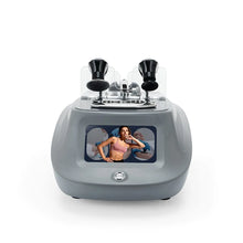 A tecar therapy machine with two black treatment heads under a clear cover and a front display screen showing a woman, photographed on a white background.
